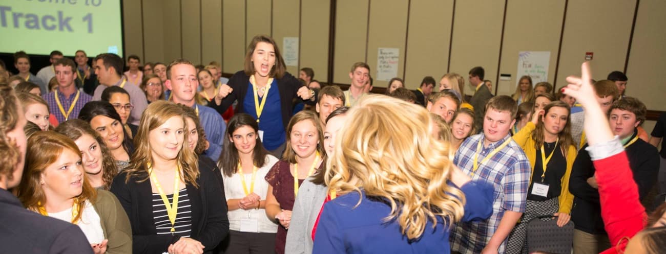 Students participating in an activity at a conference