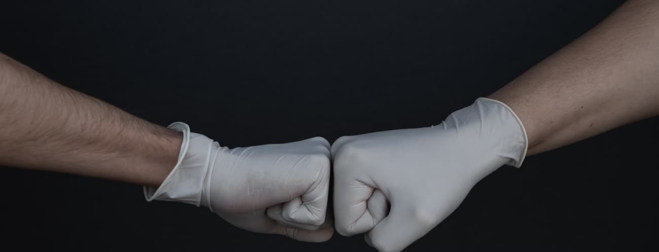 fist bump wearing gloves