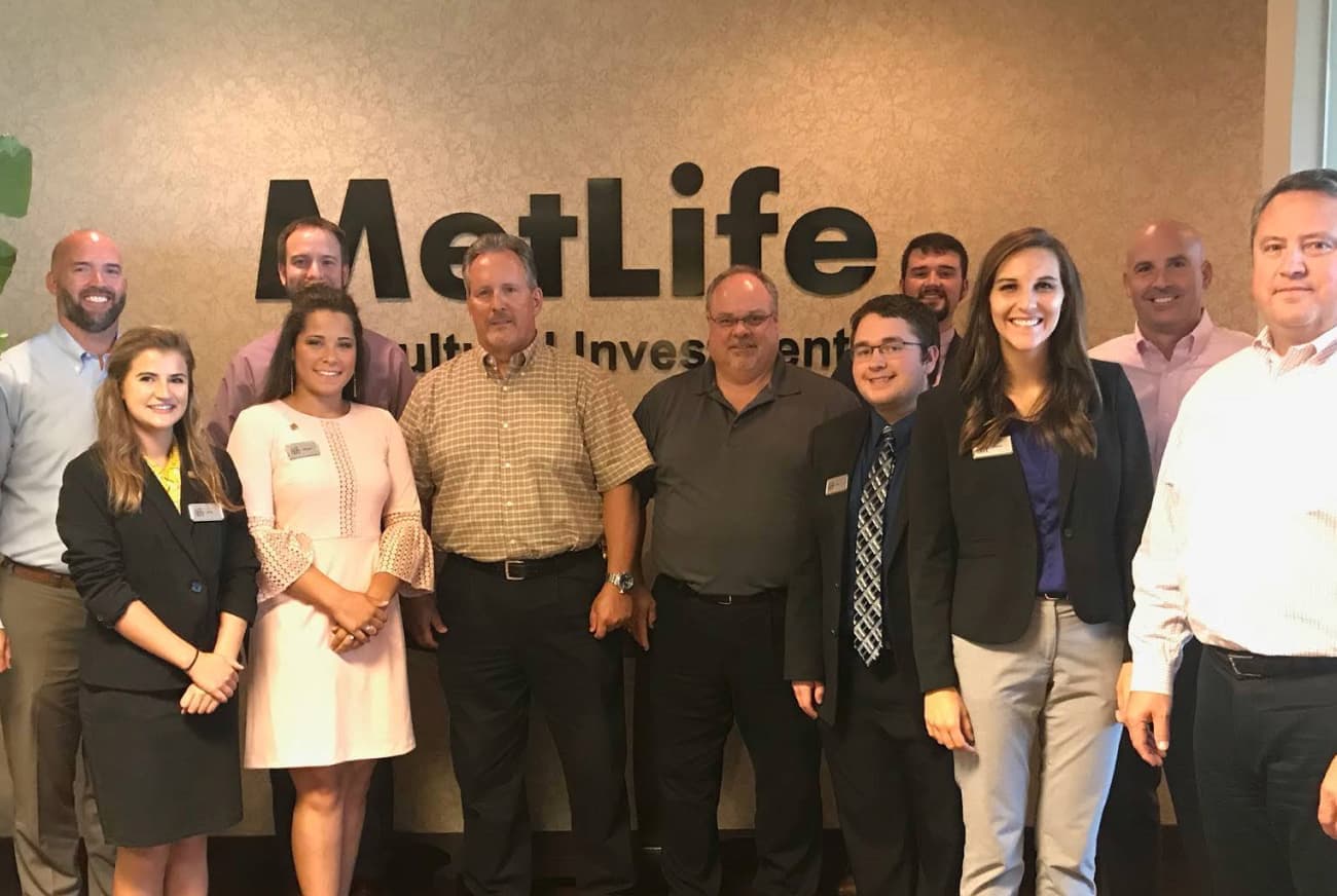 Students standing with industry partners