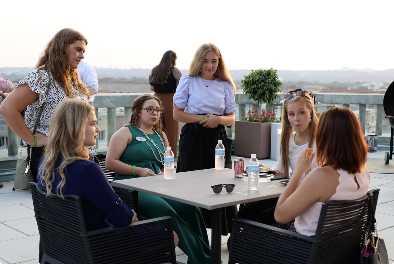Students talking outside at conference