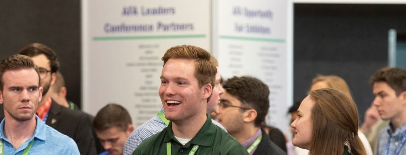 Person smiling at conference